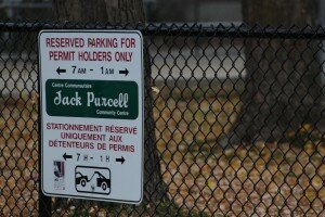 The signs posted in front of every parking spot in the lot.