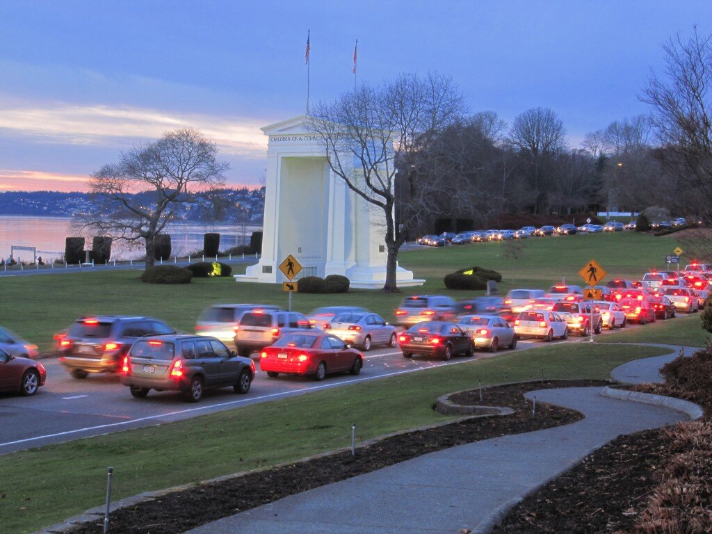 Cars wait by the Peace Arch monument at the Canadian border in Blaine, WA. Credit: Creative Commons