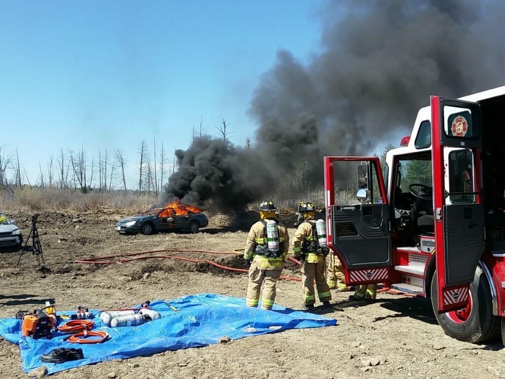 Members of the Ottawa Police Service Arson Unit conduct a controlled vehicle burn.