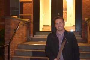Anthony Cristofari stands outside his apartment building just off of Elgin Street, the area with the highest concentration of households that break the housing affordability threshold.