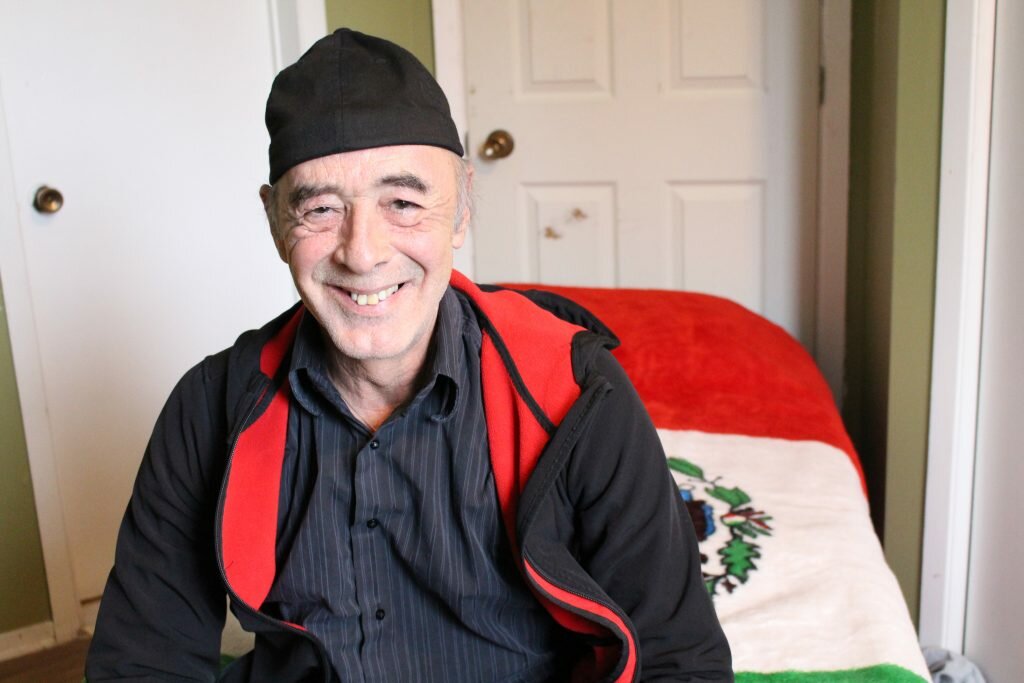 Photo Credit: Megan McPhaden Karol Frimmel Jr., 60, sits on his bed at Maison Crossroads, a federal halfway house that offers services targeted to older offenders. 