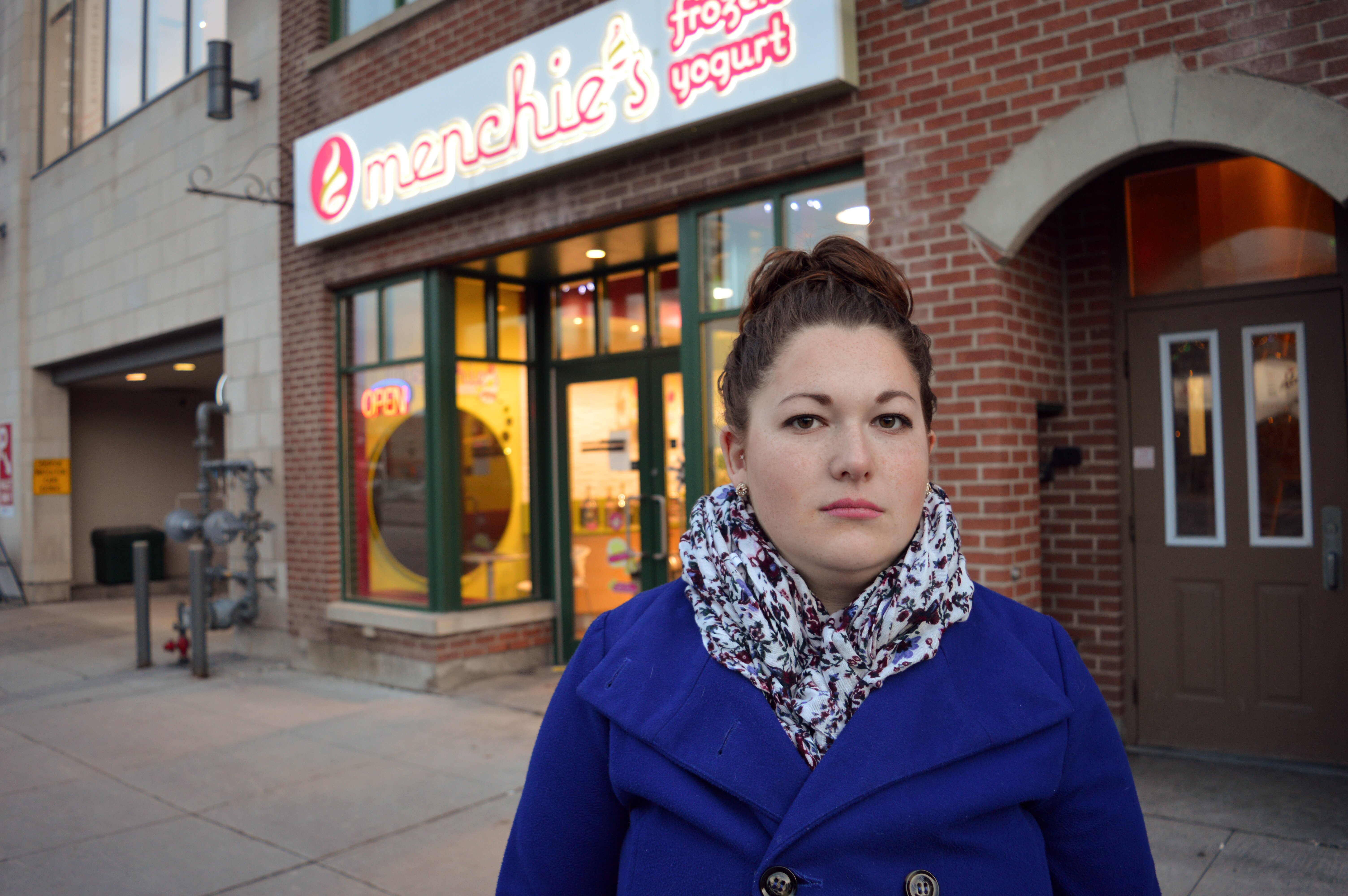 Nicole Johnston, 22, stands outside her workplace, Menchies, in the ByWard Market, whose washrooms are subject to drug use and violence. (Photo credit to Sydney LaRose)